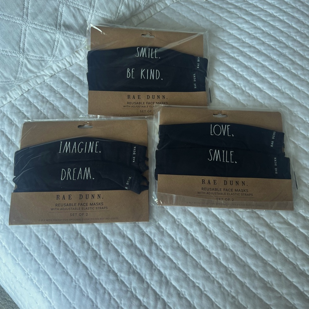 Unopened set of two Rae Dunn masks with adjustable straps